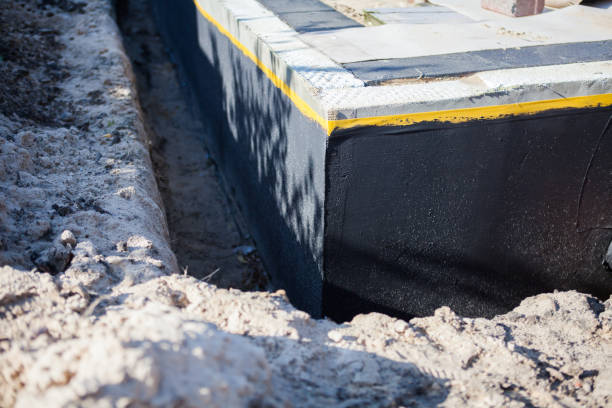 Professional Waterproofing technician working in Bath, IN